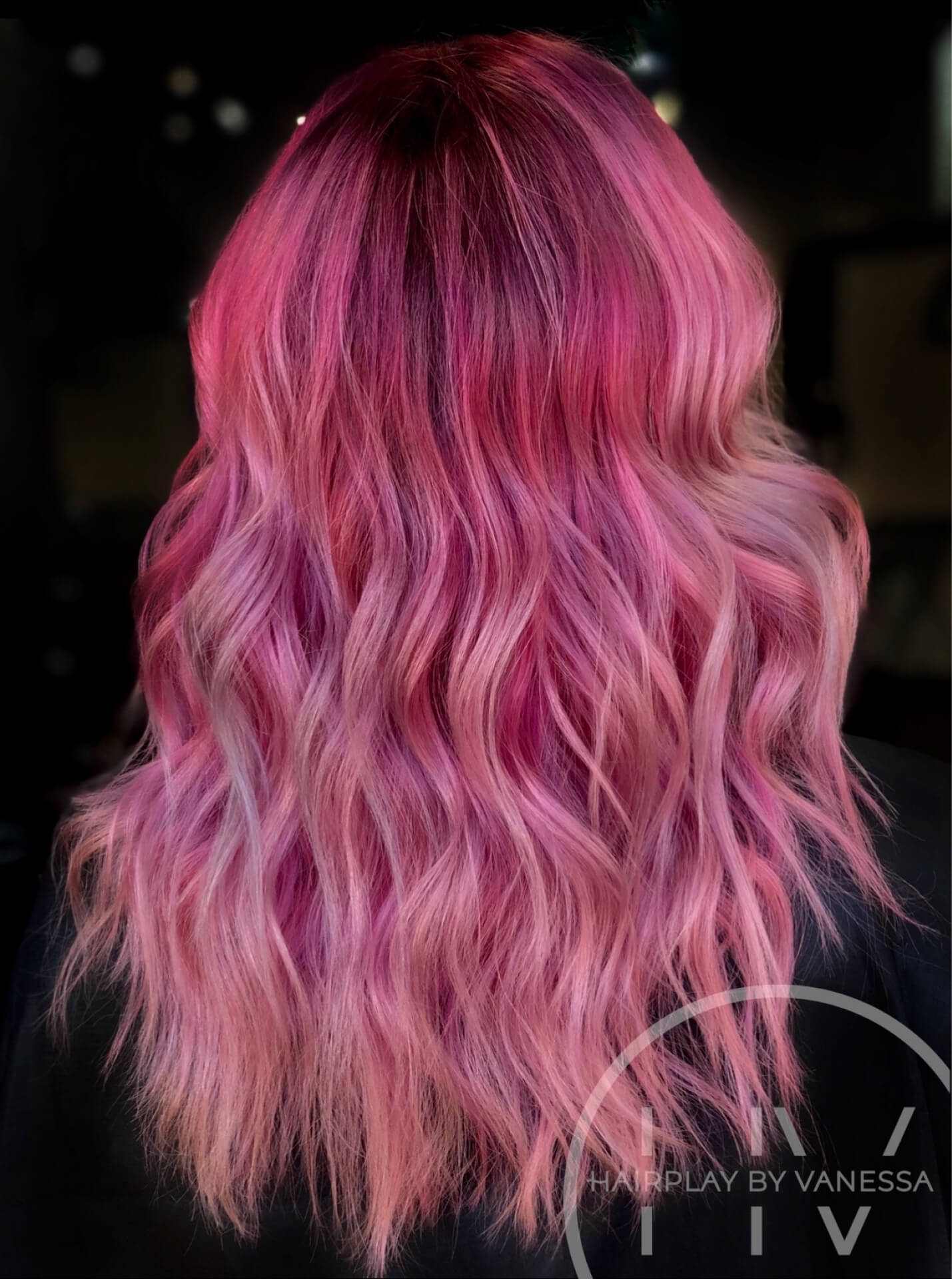 Photo of a client getting their hair washed in the salon.